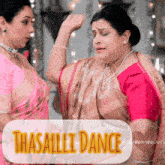 two women are dancing in front of a sign that says ' thasalli dance '