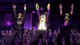 a group of people are dancing in front of a disco ball in a club .