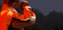 a blurry picture of a person in a red jacket