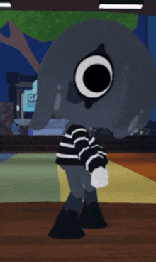 a cartoon character wearing a black and white striped shirt with a large eye