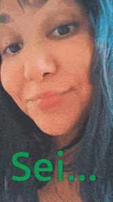 a close up of a woman 's face with the word sei in green letters