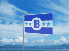 a blue and white flag with the letter b and three stars on it