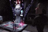a cartoon character is dancing on a dance floor in a dark room