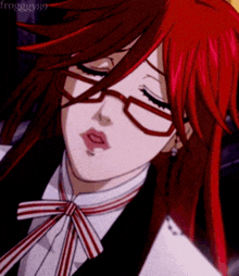 a close up of a girl with red hair and glasses