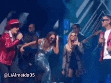 a group of people on a stage with the name lialmeida05