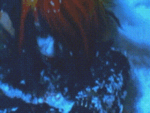 a close up of a person 's face in the water with a blurred background .