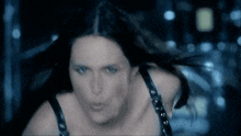 a woman in a black bra is making a face