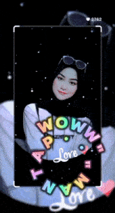 a woman wearing a hijab and sunglasses is surrounded by letters that say love