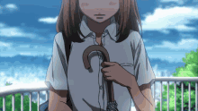 a girl in a white shirt is holding a brown umbrella
