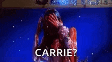 a woman with blood on her face is standing in front of a blue background and asking carrie ?