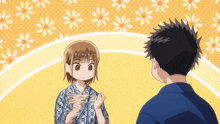 a man and a girl are standing next to each other and the girl is holding something in her hand