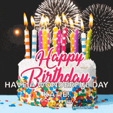 a birthday cake with candles and fireworks behind it