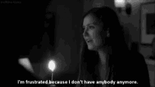 a black and white photo of a woman holding a candle with the caption i 'm frustrated