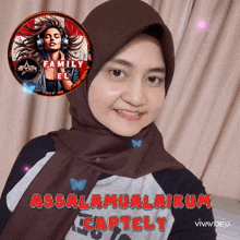 a woman wearing a hijab and a t-shirt that says assalamualaikum captely