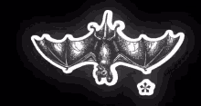 a black and white drawing of a bat with a star in the background