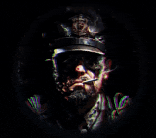 a sniper scope shows a man with a beard smoking a cigarette