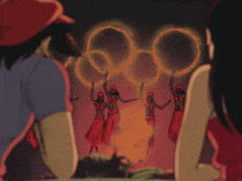 a man and a woman are looking at hula dancers