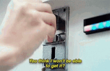 a person is putting a coin into a machine and says you think i won 't be able to get it