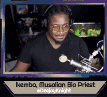 a man wearing headphones stands in front of a microphone with the name ikemba musalia bio priest