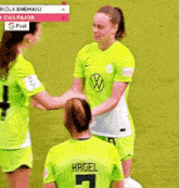 a group of female soccer players are shaking hands and one of them has the number 7 on her back