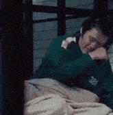 a man wearing a green sweatshirt with the number 388 on it