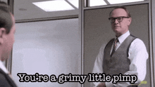 a man in a suit and tie is talking to another man and says you 're a grimy little pimp