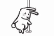 a bunny is standing on a pole with its ears up .