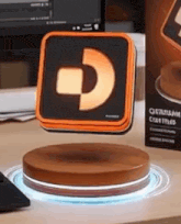 an orange and black square with a letter d on it