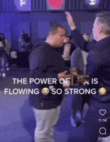 a group of men are standing in a room with the words " the power of is flowing so strong " on the bottom