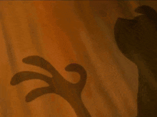 a close up of a cartoon character 's feet with a black background .