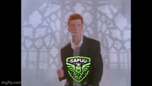 a man in a suit is dancing in front of a microphone .