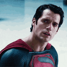 a close up of a man in a superman costume