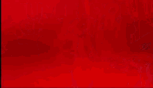 a red and white background with a yellow triangle in the corner