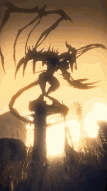 a silhouette of a monster standing on a pole