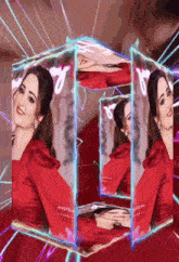 a woman in a red dress is surrounded by images of herself in a cube .