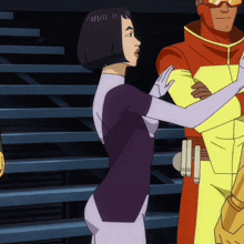 a woman in a purple suit stands next to a man in a yellow and red suit