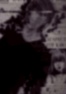 a black and red poster for death note shows a man holding a gun