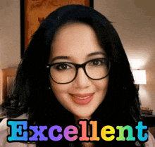 a woman wearing glasses is smiling and the words excellent are behind her
