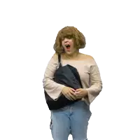 a woman wearing a wig is holding a black bag and yawning