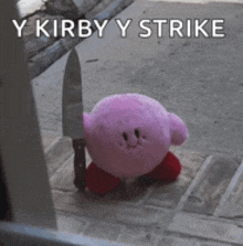 a pink kirby stuffed animal is holding a knife on the sidewalk .