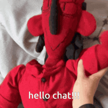 a red stuffed animal with the words hello chat on the bottom