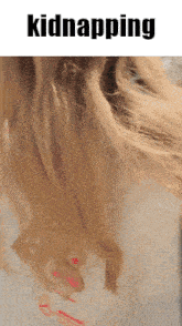 a close up of a woman 's hair with the words kidnapping above it