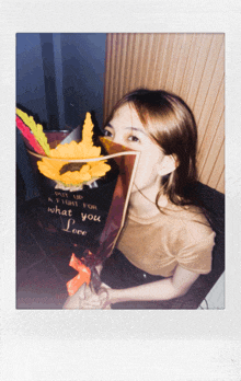 a woman holding a bouquet of flowers that says " put up a fight for what you love " on it