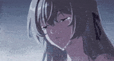 a close up of a sad anime girl crying with tears running down her face .