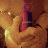 a gingerbread man is holding a pomni can