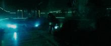 a dark room with a blue light coming out of the corner