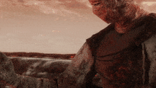 a close up of a person 's torso with blood on it