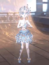 a girl in a blue dress with a crown on her head