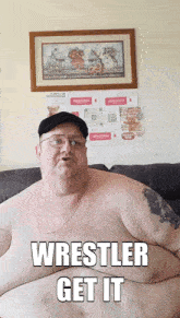a shirtless man is sitting on a couch with the words wrestler get it on his chest