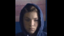 a close up of a person 's face with a blurred background